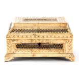 A LATE 18TH CENTURY RUSSIAN ENGRAVED BONE CASKET with pierced panels, raised on bracket feet 24cm