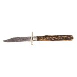 A 19TH CENTURY STAGHORN HANDLED FOLDING BOWIE KNIFE WITH HANDGUARD the locking steel single-edged