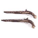 A PAIR OF 18TH CENTURY SILVER METAL AND COPPER INLAID HARDWOOD FLINTLOCK PISTOLS with ornate