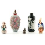 A SELECTION OF FOUR CHINESE PORCELAIN comprising of two snuff bottles 9cm and 8cm high, a figural