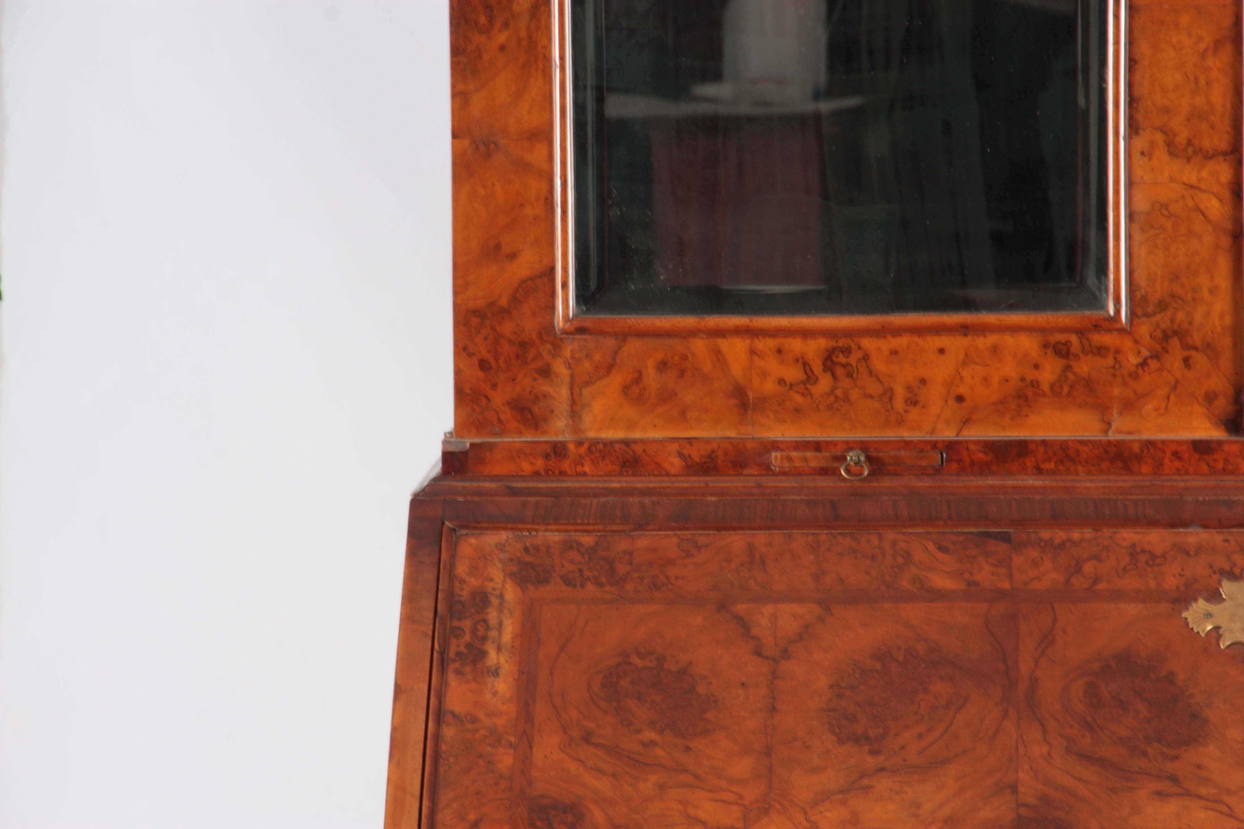 A WILLIAM AND MARY BURR WALNUT BUREAU BOOKCASE with broken arch pediment above shaped mirrored doors - Image 4 of 14