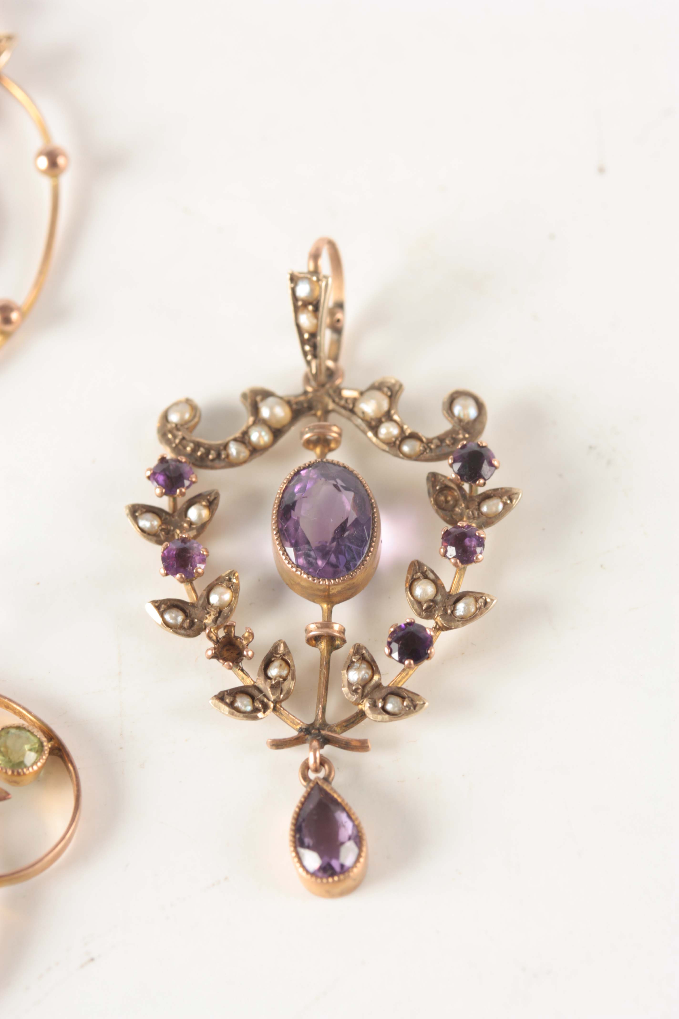 A COLLECTION OF FOUR ART NOUVEAU GOLD PENDANTS set with amethyst, ruby and pearls - total weight - Image 2 of 7