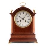 A LATE 19TH CENTURY FRENCH MAHOGANY INLAND MANTEL CLOCK having a break arch case with hinged brass