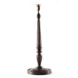 A 19TH CENTURY MAHOGANY CANDLESTICK OF LARGE SIZE with tapering reeded stem and twisted circular