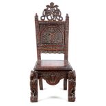 A 19TH CENTURY ANGLO INDIAN CARVED HARDWOOD SINGLE SIDE CHAIR with snakes, birds and deity’s among
