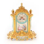 A 19TH CENTURY FRENCH ORMOLU AND PORCELAIN PANELLED MANTEL CLOCK having urn finials and acanthus