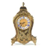 GROGNIE, A PARIS. AN EARLY 19TH CENTURY FRENCH CONTRA BOULLE MANTEL CLOCK the balloon-shaped case