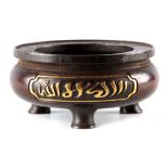 A CHINESE BRONZE CENSER with inset brass panels depicting script signed to the base with circular