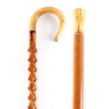 TWO 19TH CENTURY WALKING STICKS, one MALACCA WITH AN IVORY SHAPED POMMEL INITIALED J.H. 89.5cm