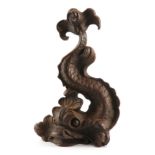 A LATE 19TH CENTURY CAST IRON DOOR STOP MODELLED AS A DOLPHIN 34cm high.