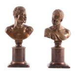 A PAIR OF 19TH CENTURY PATINATED BRONZE BUSTS modelled as an African man and woman raised on