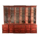 A MAGNIFICENT GEORGE III MAHOGANY COUNTRY HOUSE TRIPLE BREAKFRONT BOOKCASE IN THE MANNER OF