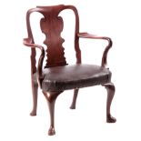 A GEORGE I WALNUT OPEN ARMCHAIR OF GENEROUS SIZE with shaped back splat, crook arms and leather