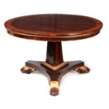 A REGENCY CIRCULAR ROSEWOOD TABLE IN THE MANNER OF GEORGE BULLOCK with Fleur-de-leys inlaid