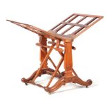 A MID 19TH CENTURY FIGURED WALNUT FOLIO STAND with panelled adjustable sides; raised on tapering