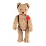 A MID 20TH CENTURY SCHUCO YES/NO TRICKY TEDDY BEAR with light brown mohair, amber and black glass