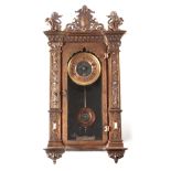 A LATE 19TH CENTURY MINIATURE VIENNA STYLE WALL CLOCK the bronze case with pierced pediment