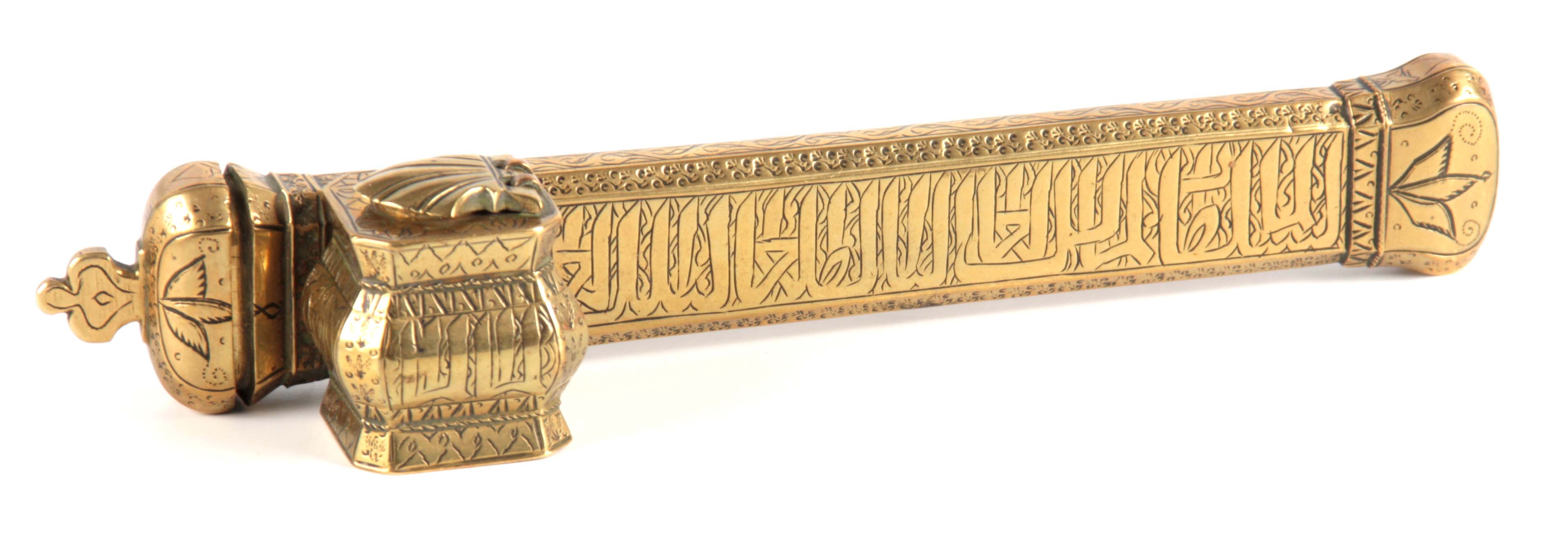 A 19TH CENTURY SIGNED MIDDLE EASTERN BRASS INKWELL QALAMDAN with Arabic calligraphy to the sides.