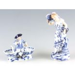 A 20TH CENTURY MEISSEN TABLE SALT with seated figure of a boy 12cm high 14cm wide TOGETHER WITH A