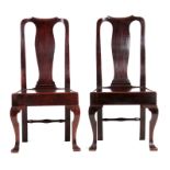 A GOOD PAIR OF EARLY 18TH CENTURY WALNUT SIDE CHAIRS of superb colour and patina, having shaped