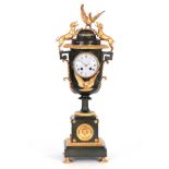 A LARGE 19TH CENTURY FRENCH BRONZE AND ORMOLU MOUNTED URN-SHAPED MANTEL CLOCK the case surmounted by