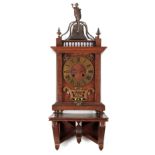 AN CONTINENTAL WALNUT AND BRASS MOUNTED BRACKET CLOCK WITH BRACKET the gothic case surmounted by a