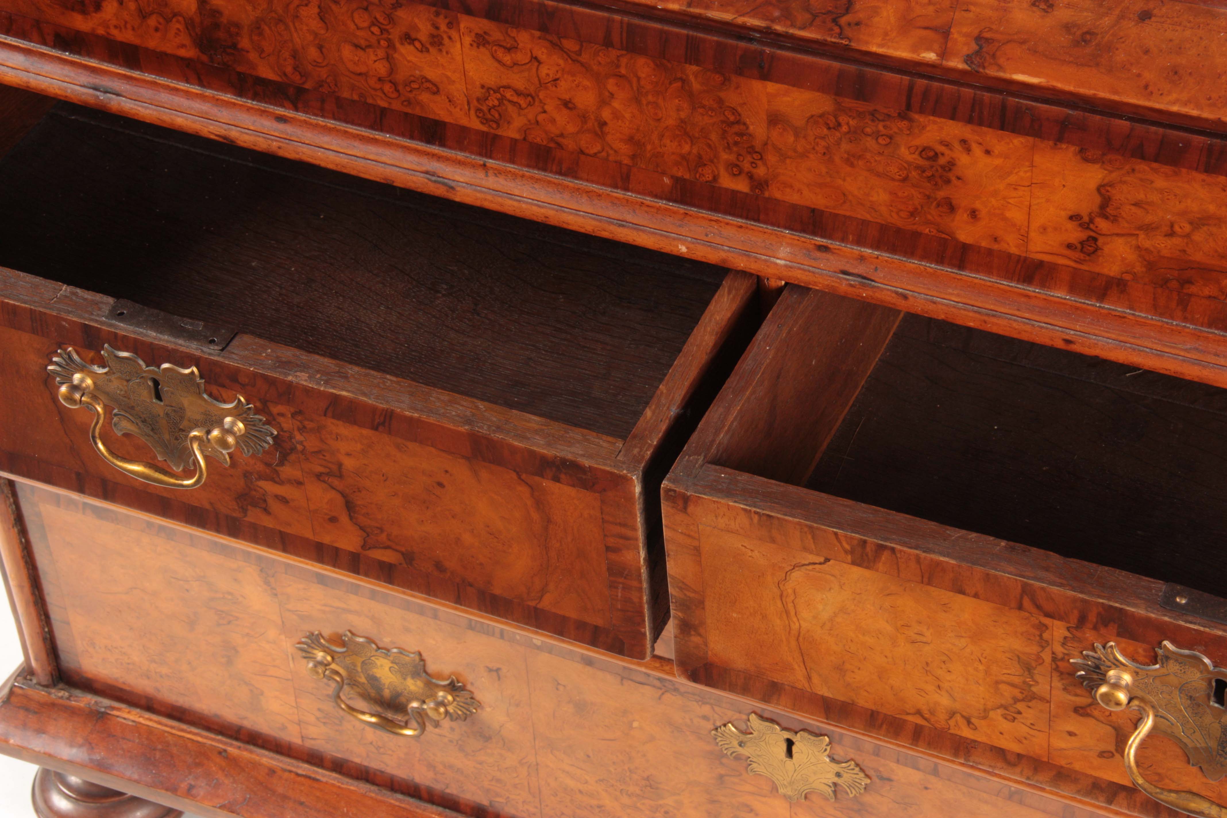 A WILLIAM AND MARY BURR WALNUT BUREAU BOOKCASE with broken arch pediment above shaped mirrored doors - Image 14 of 14