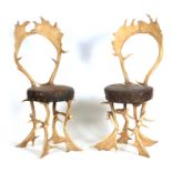 A PAIR OF LATE 19TH CENTURY STAG ANTLER CHAIRS the chairs formed as a variety of antlers and with