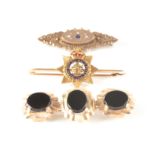 A 9CT GOLD AND BLACK ONYX BROOCH 56mm wide, app. 10.6g. together with A British chivalric Order of
