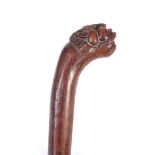 AN EARLY CARVED HARDWOOD SOUTH SEAS FIGHTING CLUB with carved serpents head 69cm overall