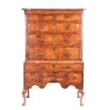 A GOOD EARLY 18TH CENTURY HERRING-BANDED FIGURED WALNUT CHEST ON STAND with moulded cornice above