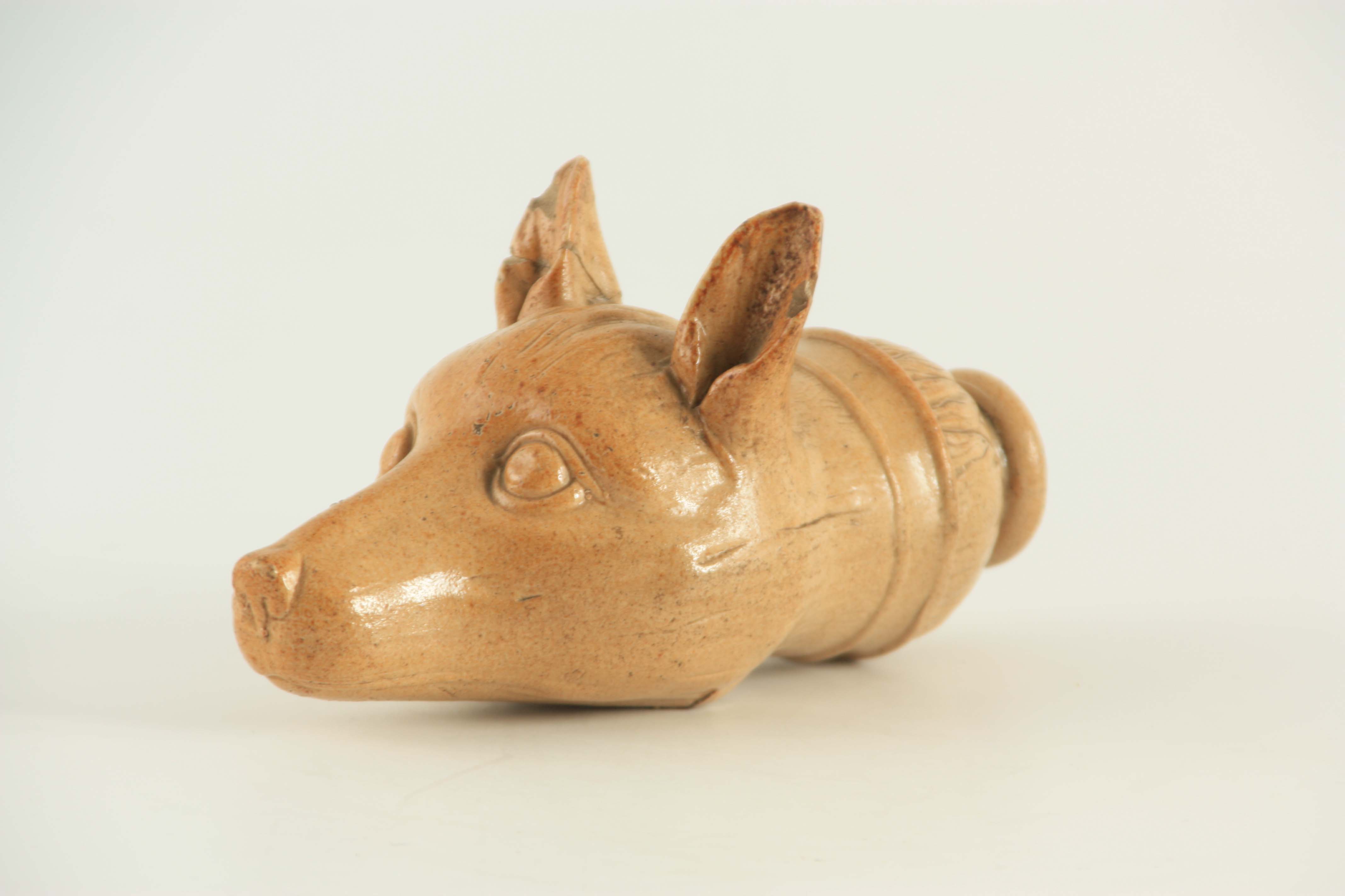 AN EARLY 19TH CENTURY STONEWARE FOX HEAD STIRRUP CUP 19cm overall. - Image 2 of 3