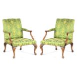 A PAIR OF LATE 19TH CENTURY MAHOGANY CHIPPENDALE STYLE UPHOLSTERED GAINSBOROUGH CHAIRS OF GENEROUS