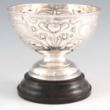 AN EDWARD VII ART NOUVEAU EMBOSSED SILVER FRUIT BOWL AND STAND by Hawksworth Eyre, Sheffield,
