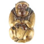 A JAPANESE MEIJI PERIOD MIXED METAL NOVELTY VESTA CASE modelled as a seated monkey holding a
