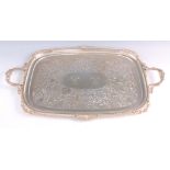 A LARGE GEORGE V SILVER TWO HANDLED TRAY the raised border with shell decoration and gadrooned