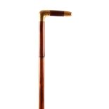 A LATE 19TH CENTURY STEPPED MALACCA AND GOLD METAL WALKING STICK with engraved monogram to the
