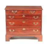 A GOOD GEORGE III MAHOGANY CHEST OF DRAWERS OF SMALL SIZE with moulded edge top above two small