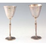 A PAIR OF ELIZABETH II SILVER TEWKESBURY GOBLETS, marking the 850th anniversary of the
