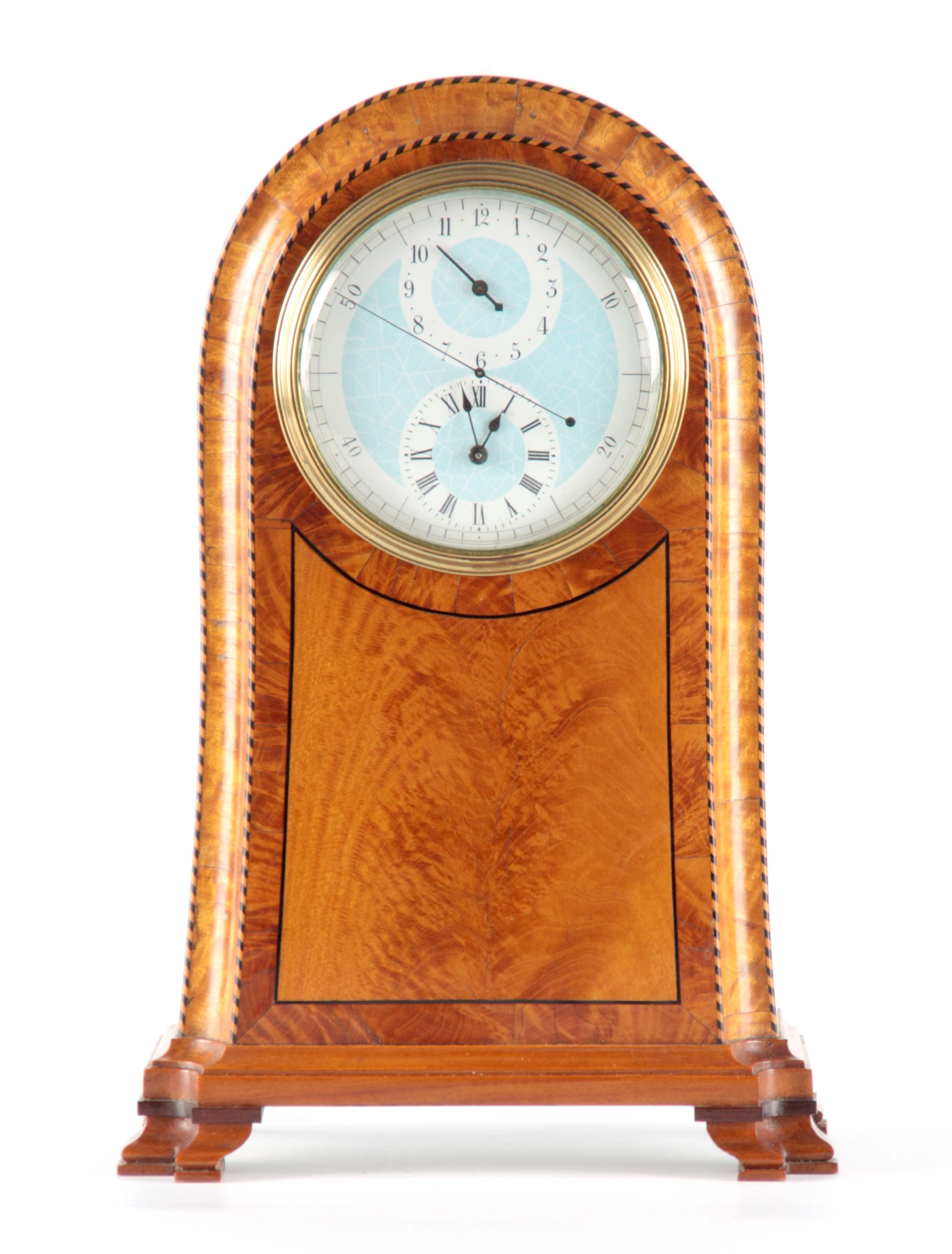 AN UNUSUAL EDWARDIAN SATINWOOD MANTEL ALARM CLOCK the arched case with concave moulded edge and