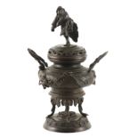 A LATE 19TH CENTURY CHINESE BRONZE CENSER with figural pierced lid above a bulbous body with