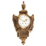 A LATE 19th CENTURY FRENCH GILT BRASS CARTEL CLOCK with large urn finial and rams head decoration