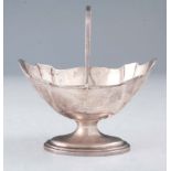 AN EDWARD VII SILVER SWING-HANDLE BASKET with engraved eagle motif to the body by William Aitken,