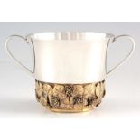 A LATE 20TH CENTURY COMMEMORATIVE SILVER GILT CHRISTENING BOWL with water lilies and lily pads,