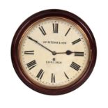 A LATE 19TH CENTURY MAHOGANY CASED RAILWAY STATION CLOCK the moulded surround enclosing a 12"