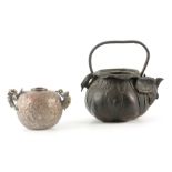 AN EARLY CHINESE PATINATED BRONZE TEAPOT having a lotus-shaped body and loop handle, 13.5cm high;