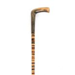 A SECTIONAL HORN WALKING STICK WITH RHINO HORN HANDLE 84cm overall