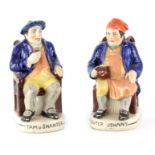 A PAIR OF COLOURFUL SEATED STAFFORDSHIRE TOBY JUGS depicting 'Tam o Shanter' and 'Souter Johnny'