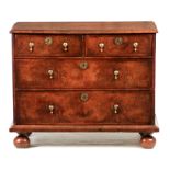 A WILLIAM AND MARY FIGURED WALNUT AND HERRING-BANDED CHEST OF DRAWERS with cross-grain moulded