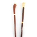 TWO 19TH CENTURY IVORY MOUNTED WALKING STICKS one with a Rosewood shaft and notched handle 91cm